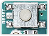 The reset button on Arduino UNO.