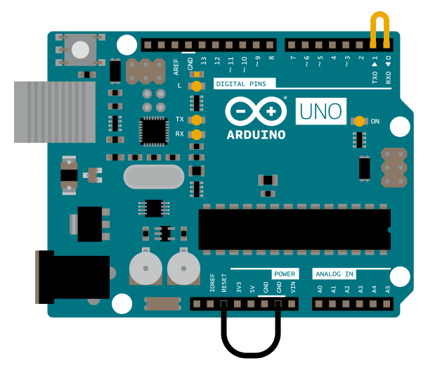 Arduino UNO with jumper cables connecting TX-RX and RESET-GND.